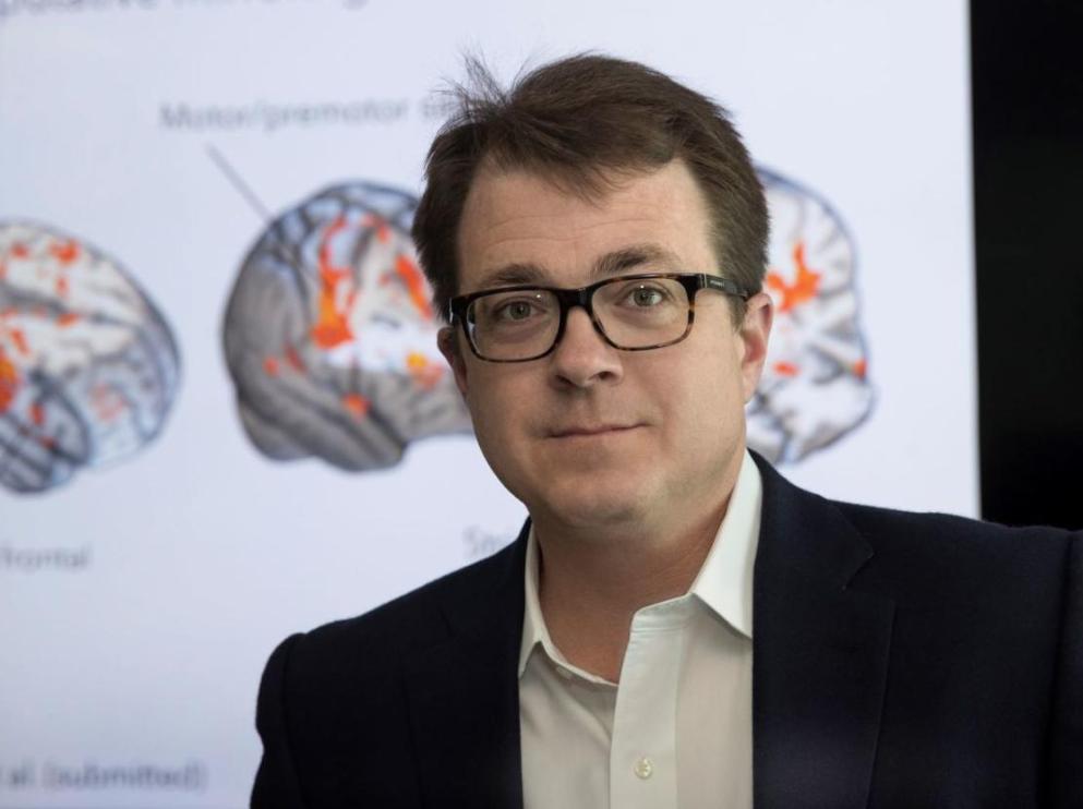 Kevin Pelphrey Headshot with Brain Images