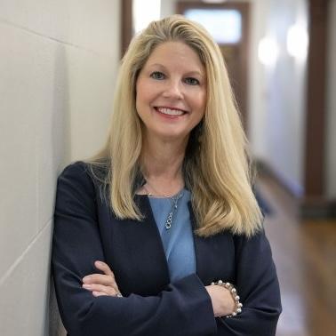 Lori McMahon hallway headshot
