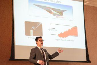 Person presenting in front of audience