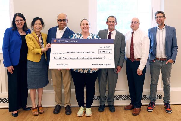 Members of UVA’s leadership community present a check to commemorate President Jim Ryan’s “Run With Jim” Boston Marathon campaign. From left to right: Senior Associate Vice President for Health System Development Amy Karr, Department of Neurology Chair Dr. Xuemei Huang, Brain Institute Co-Director Dr. Jaideep Kapur, Brain Institute Co-Director Sarah Kucenas, Ryan, Interim Executive Vice President for Health Affairs Dr. Mitch Rosner and John Lukens, director of the Harrison Center for Translational Alzheimer