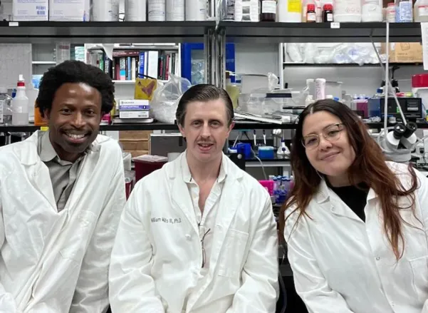 Three scientists white coats