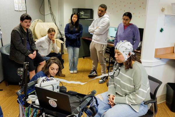 Puglia shows students Gomez’s brain wave patterns. (Photo by Lathan Goumas, University Communications)