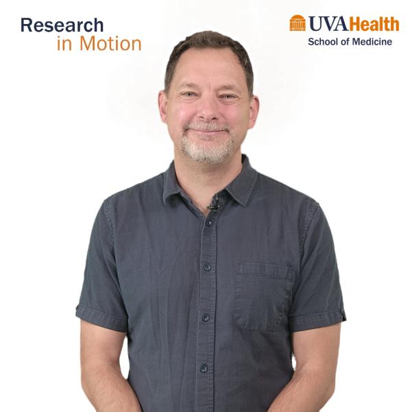 Man standing and smiling with white background