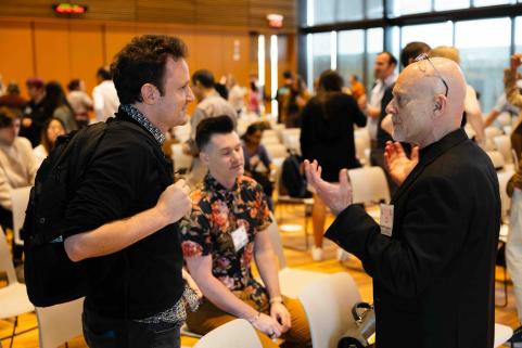 Guest speakers socialize.